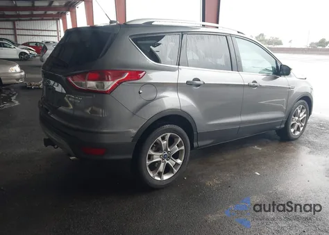 2014 Ford Escape Titanium z USA, uszkodzony, nr VIN 1FMCU0J91EUE57538